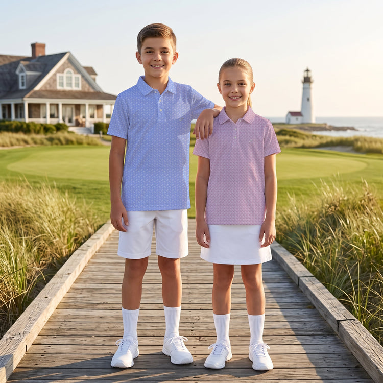Two kids wearing golf polos. male child wearing Plum Crazy and girl is wearing stream bed
