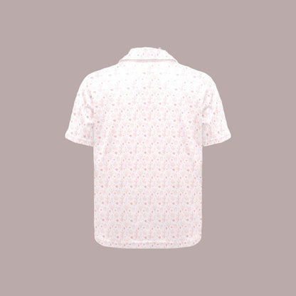 White floral patterned shirt on a gray background