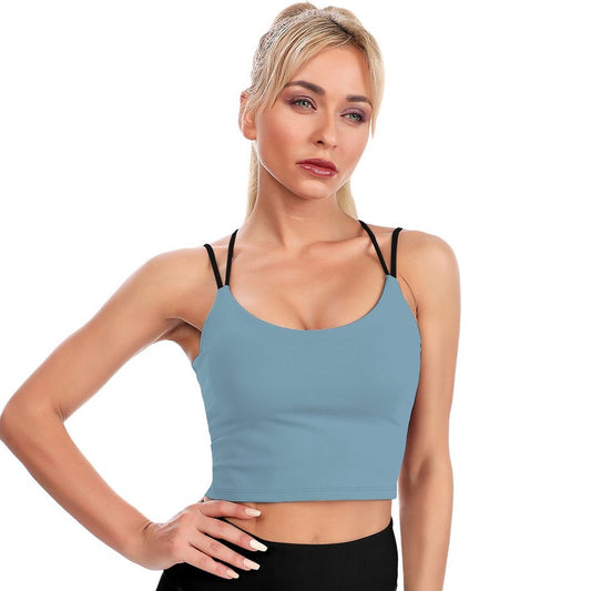 Woman wearing a light blue tank top on a white background