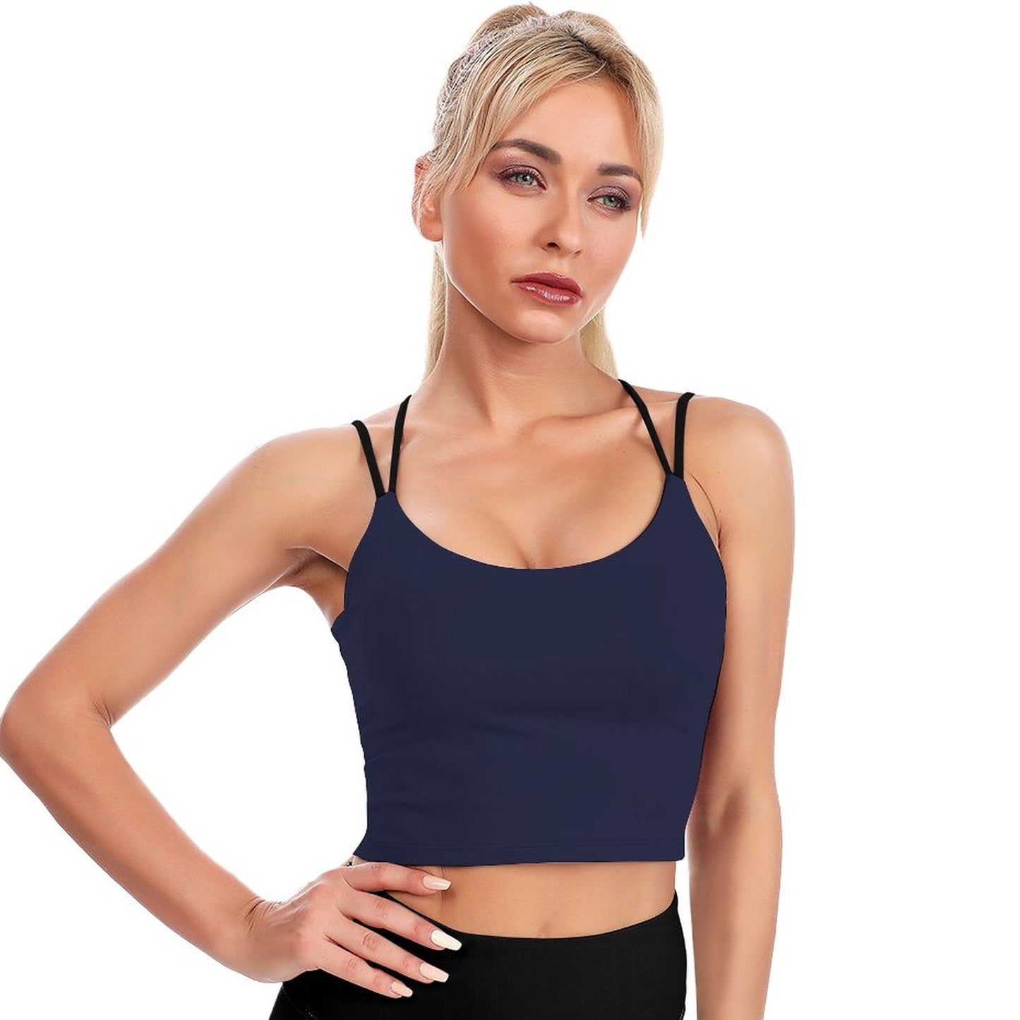 Woman wearing a navy blue sports bra on a white background