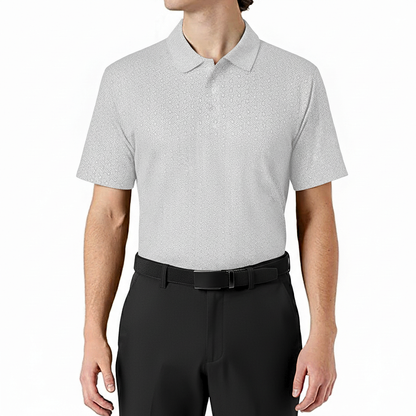 Person wearing a white and black geometric patterned polo shirt and black pants on a white background