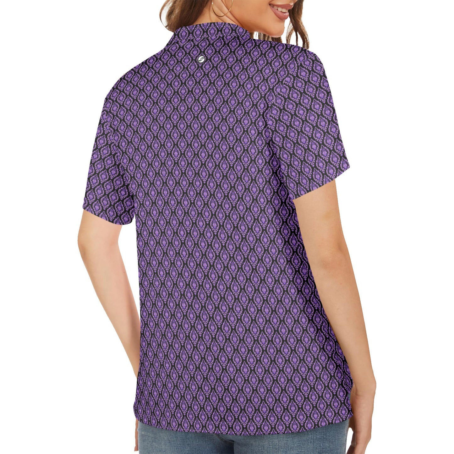 Person wearing a purple patterned shirt on a white background