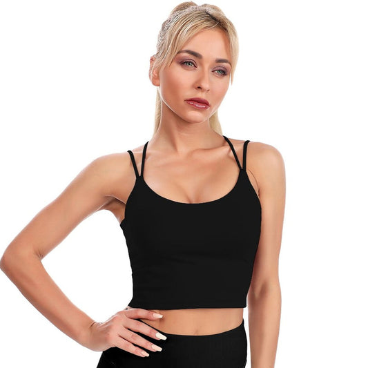 Woman wearing a black tank top against a white background